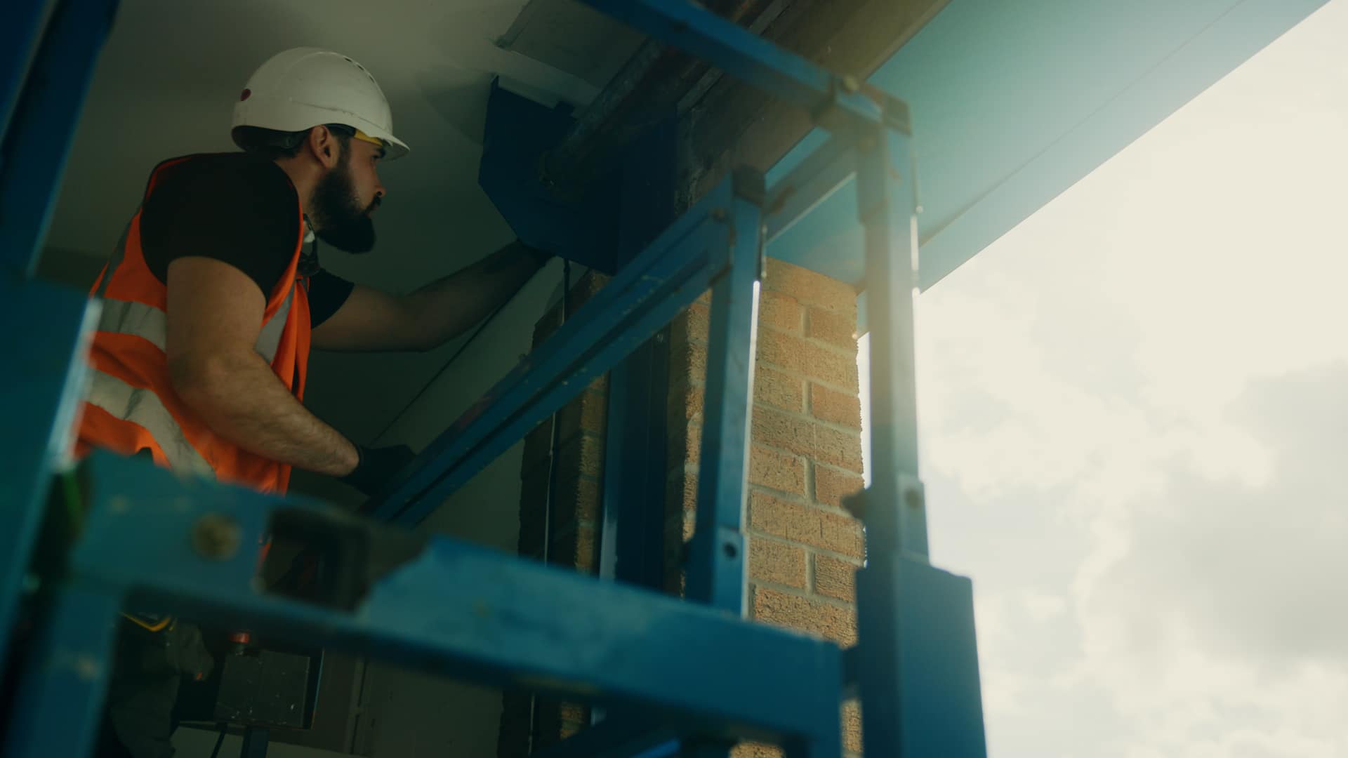 An engineer working on a raised platform