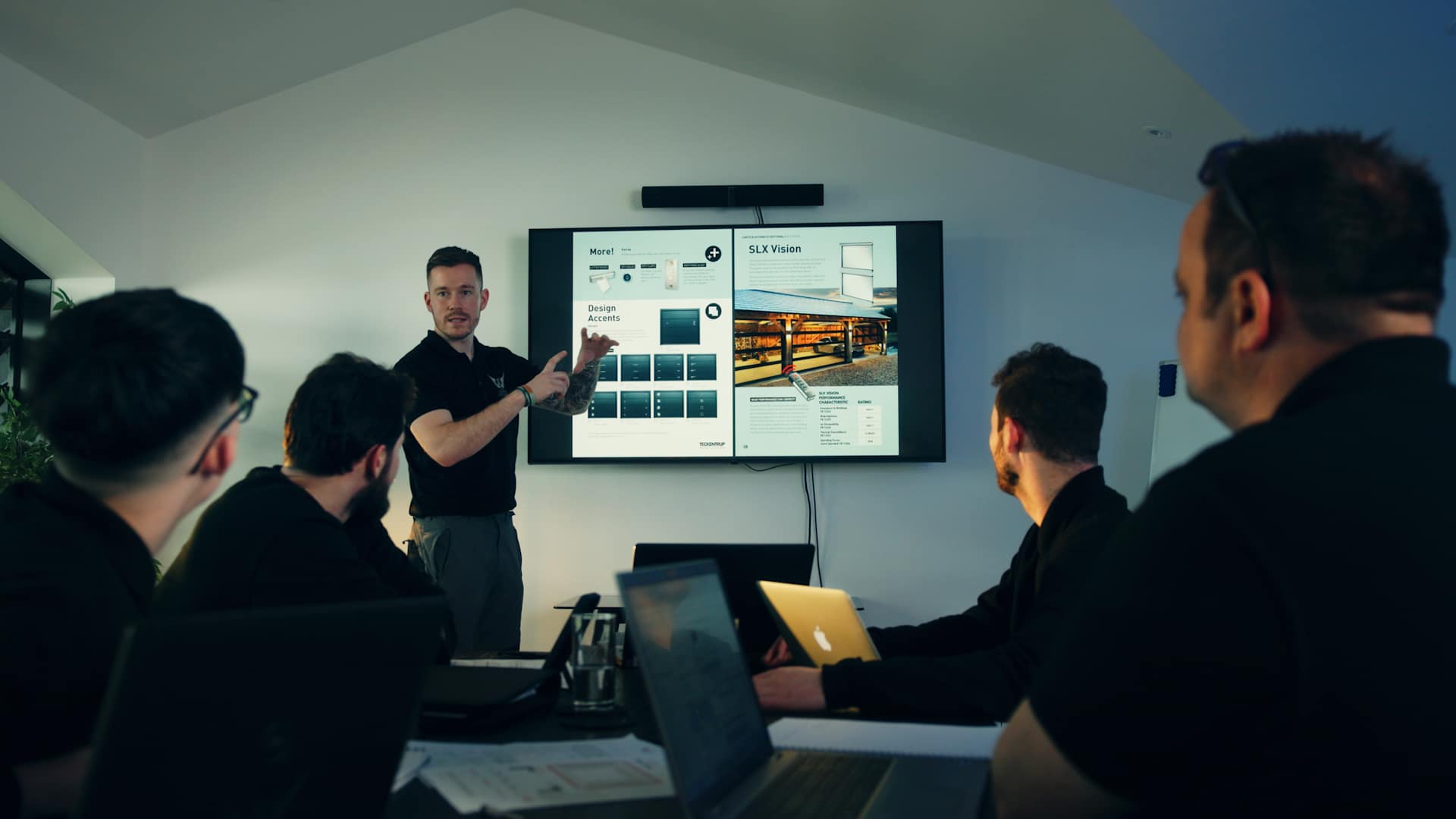 An office presentation on a large TV
